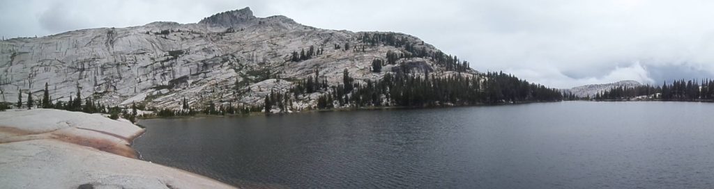 a panorama of cathedral lake in yosemite national park