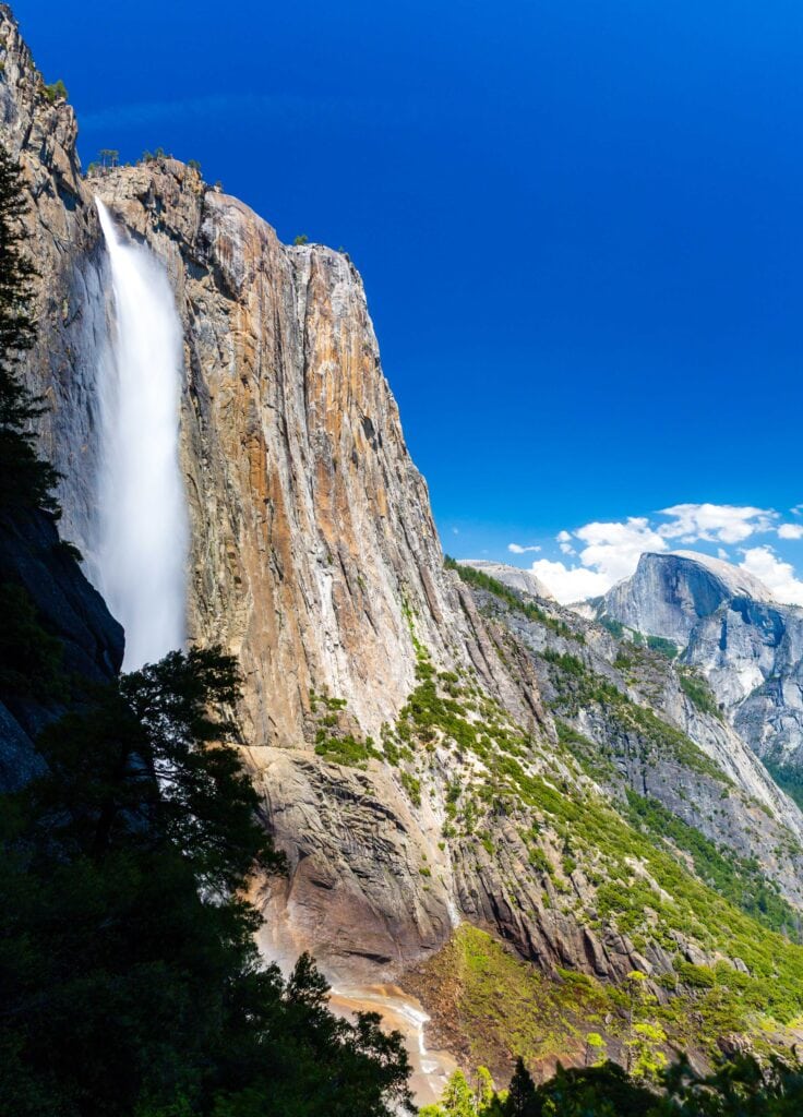upper yosemite falls with half dome in the background