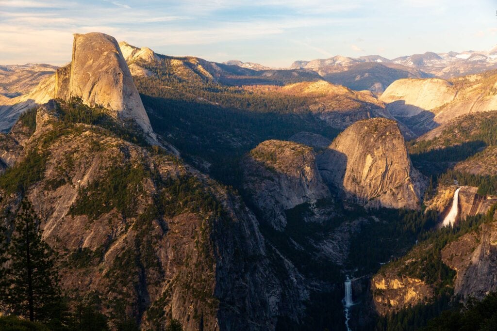 sunset glow at glacier point in yosemite national park with waterfalls in view