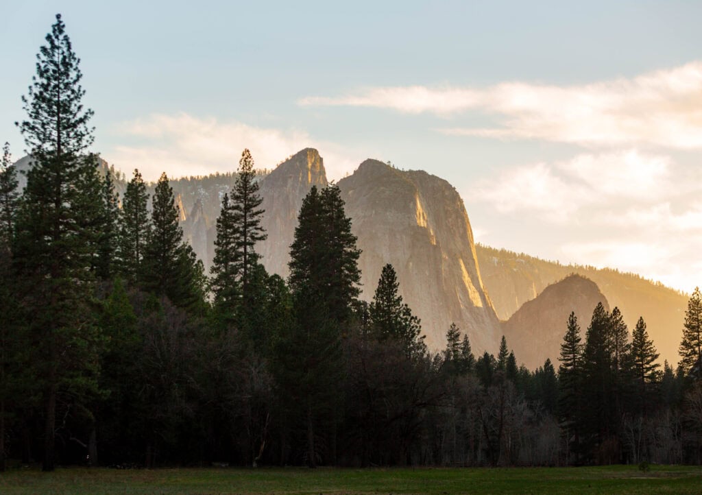 soft golden light on the walls surrounding yosemite valley during sunset