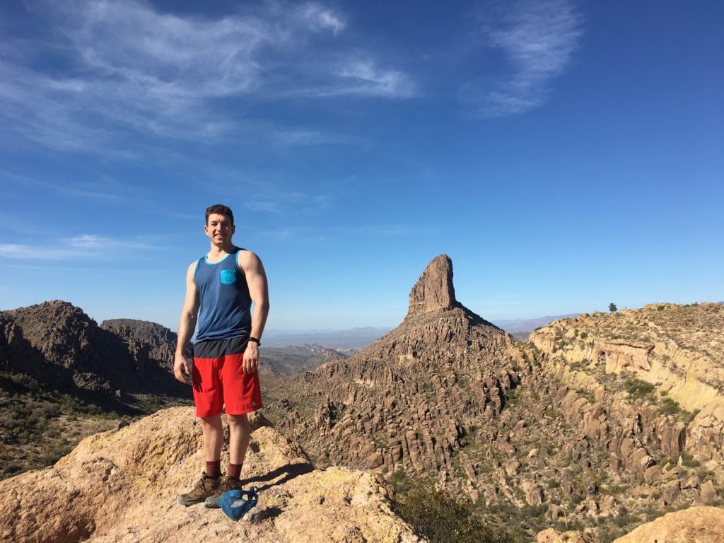 a hiker smiles at the camera at fremont saddle in arizona