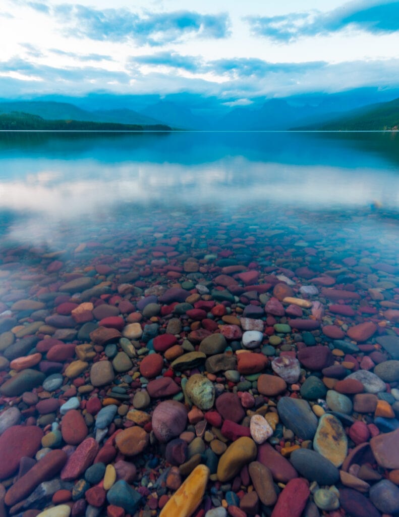 the colorful rocks at lake mcdonald in glacier national park