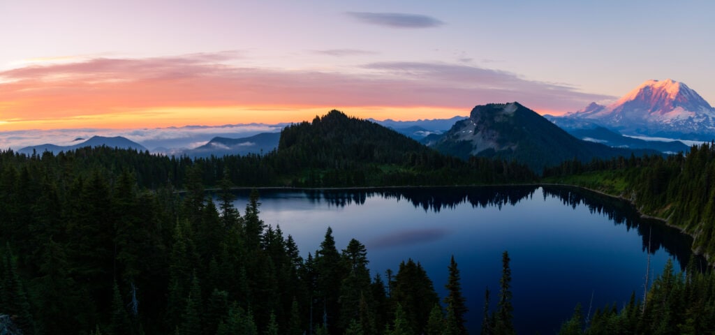 Sunrise above summit lake with Mt Rainier in the background. 