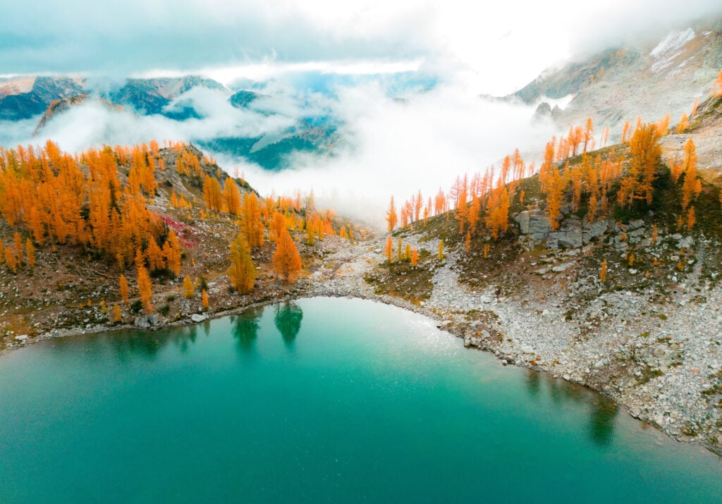 Wing Lake with Larches and clouds near sunrise. 