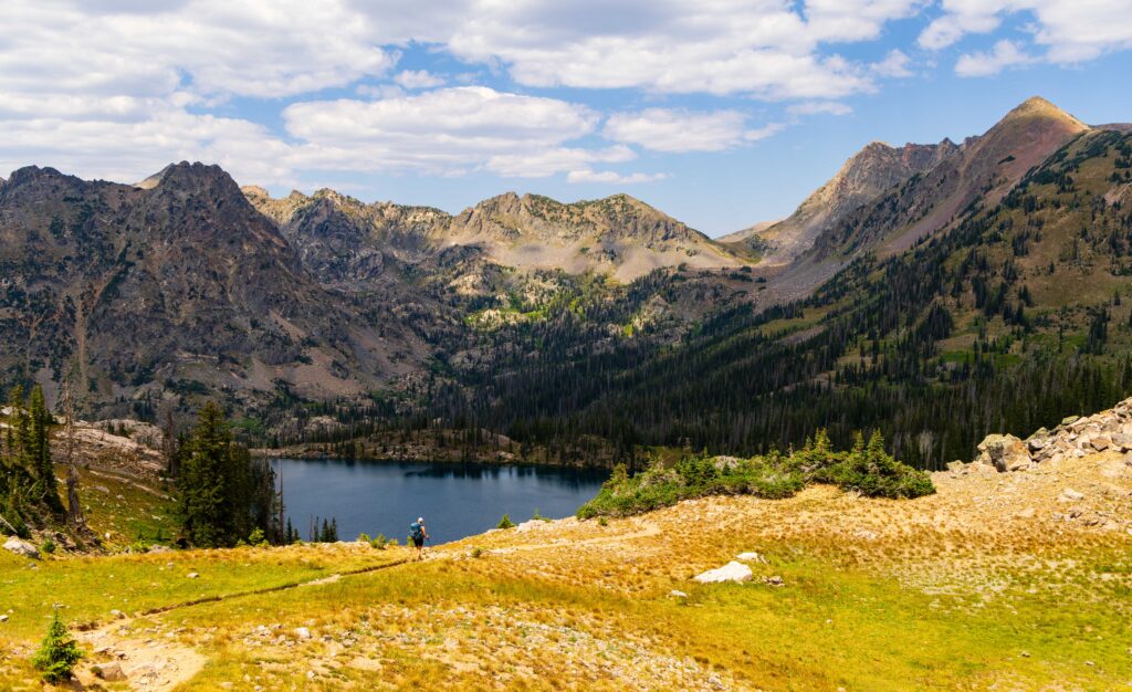 a hiker above gilpin lake on the zirkel circle in colorado