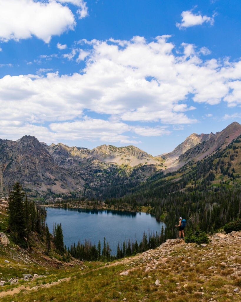 a view above gilpin lake from the pass with clouds in the sky