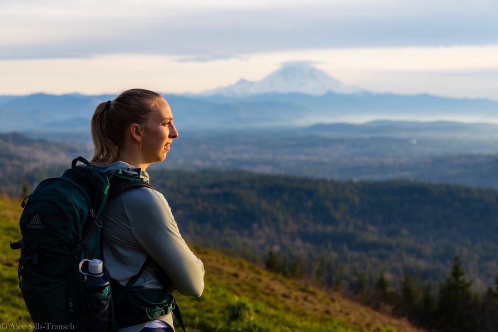 a female looks out at mount rainier from the south launch of poo poo point