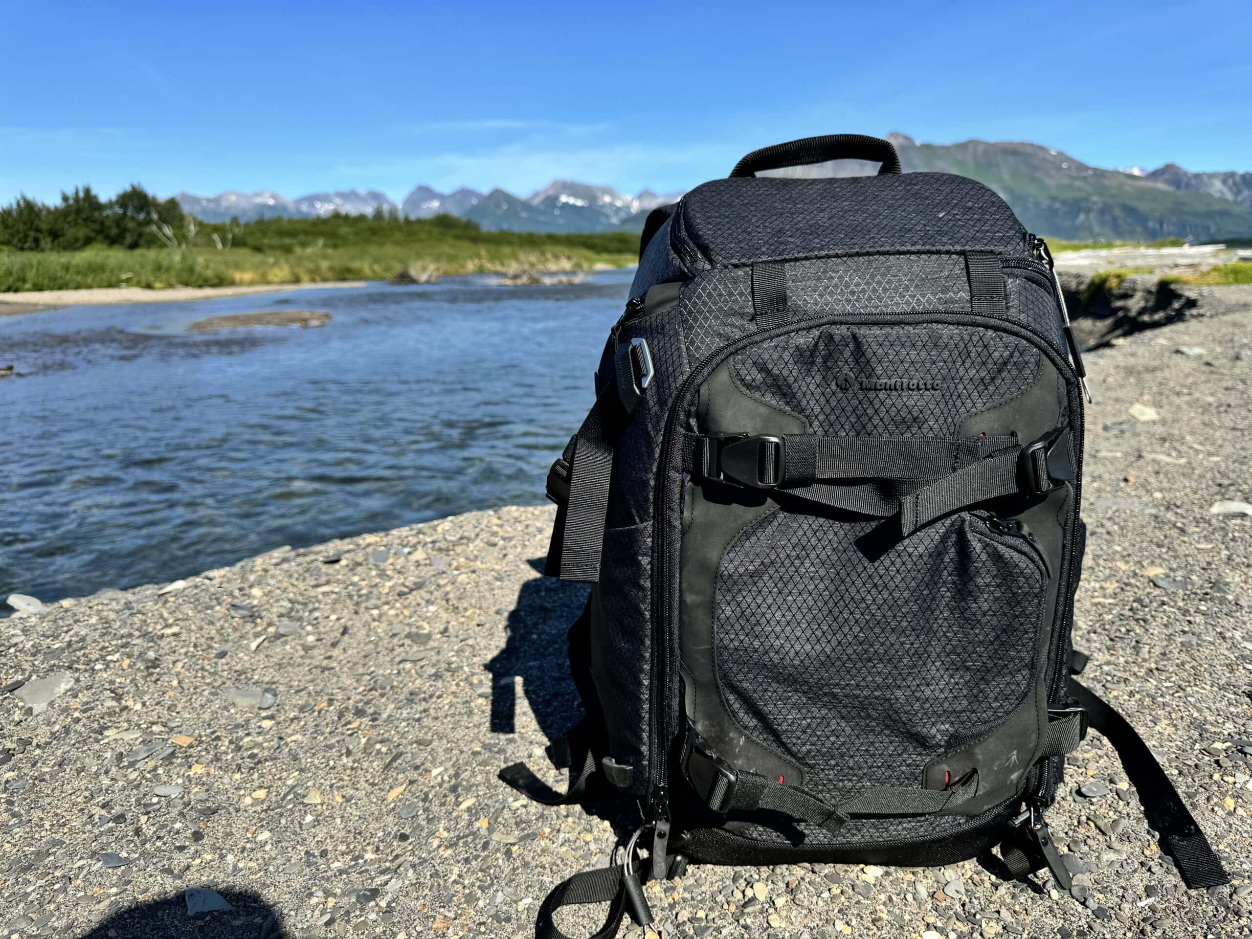 A PRO Light Multiloader Camera Backpack M sitting on the ground