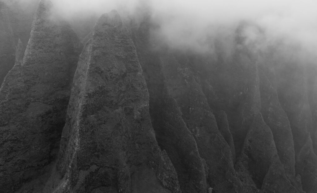 black and white image of the spires along the na pali coast line