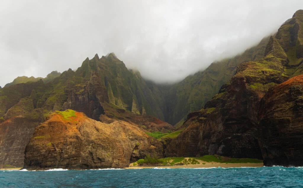 a cloudy na pali coast from the boat cruise, one of the best things to do in kauai
