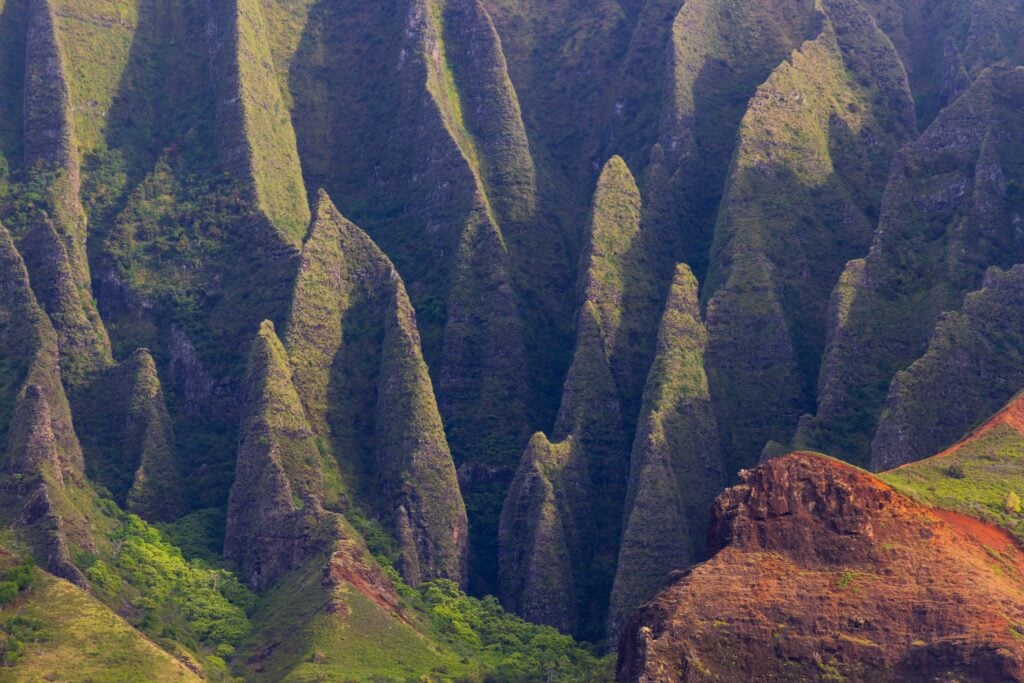 jagged spires along the na pal coast seen from the water