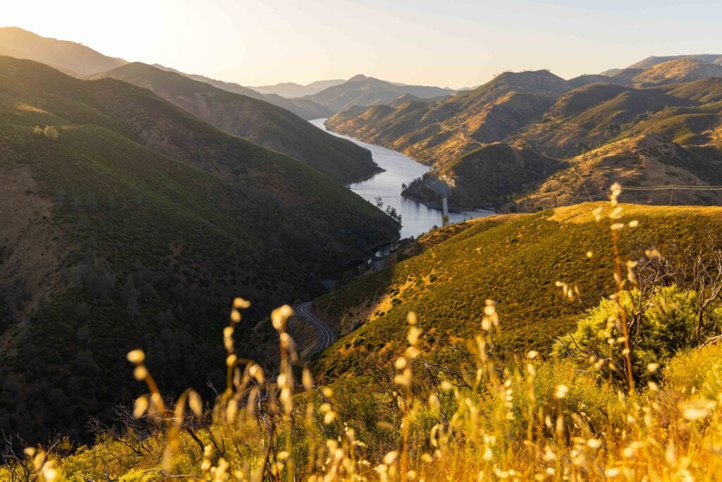 view of grasses and lake mcclure near bagby recreation area