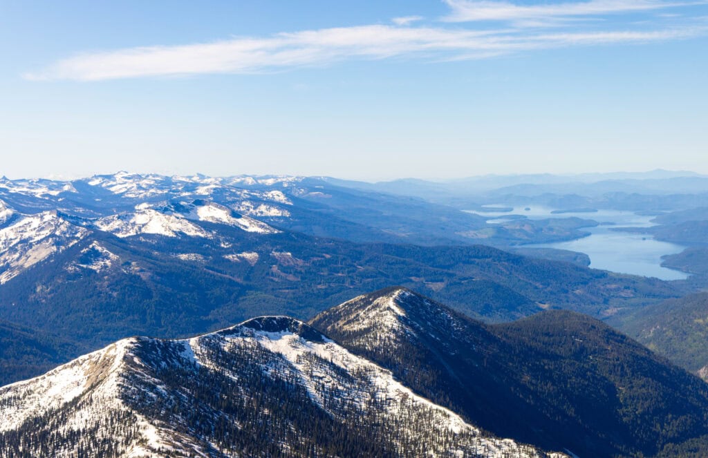 priest lake in the back right, with mountains stretching to the horizon