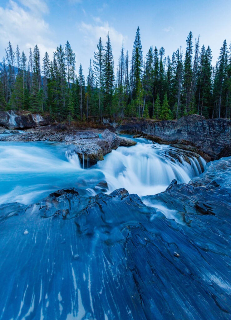 long exposure photo of water flowing at the natural bridges stop in canada