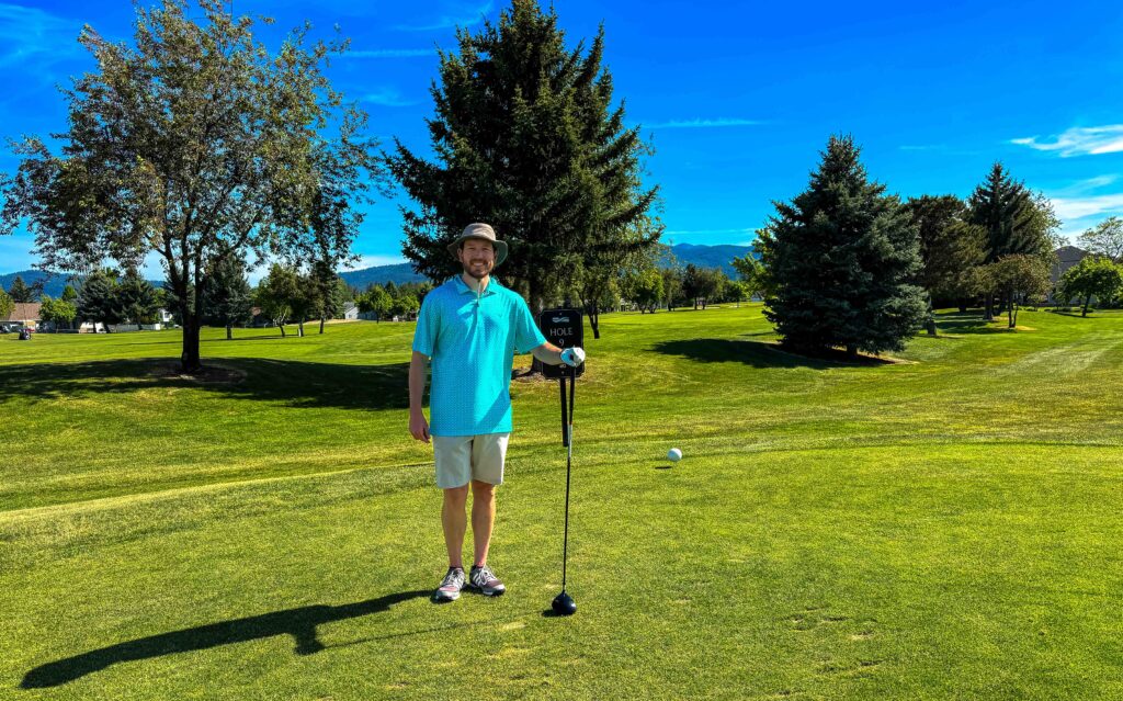 a golfer looks at the camera at the club at prarier falls in post falls idaho