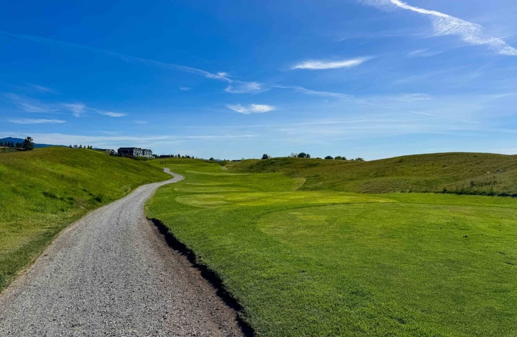 a winding cart path on a golf course