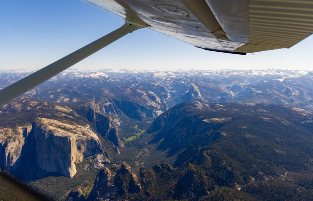 flightseeing over yosemite with el cap on the left and half dome down the middle