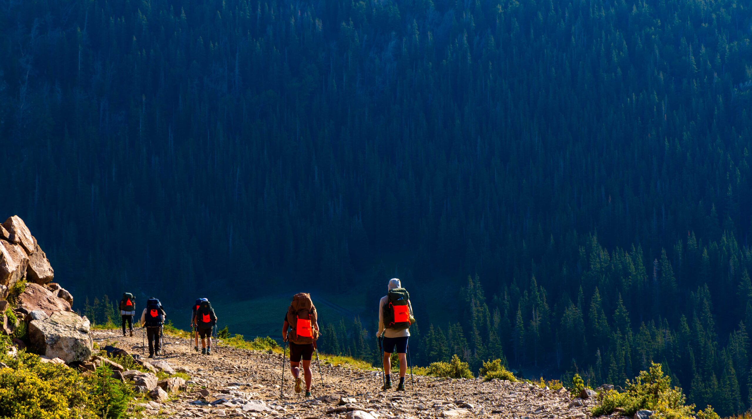 hikers walk down the trail during the fjallraven annual classic in colorado