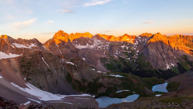 first light on the san juan mountains above blue lake