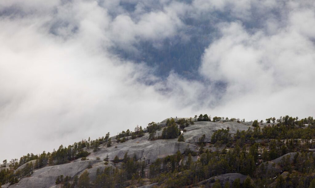 hikers on top of a mountain near squamish