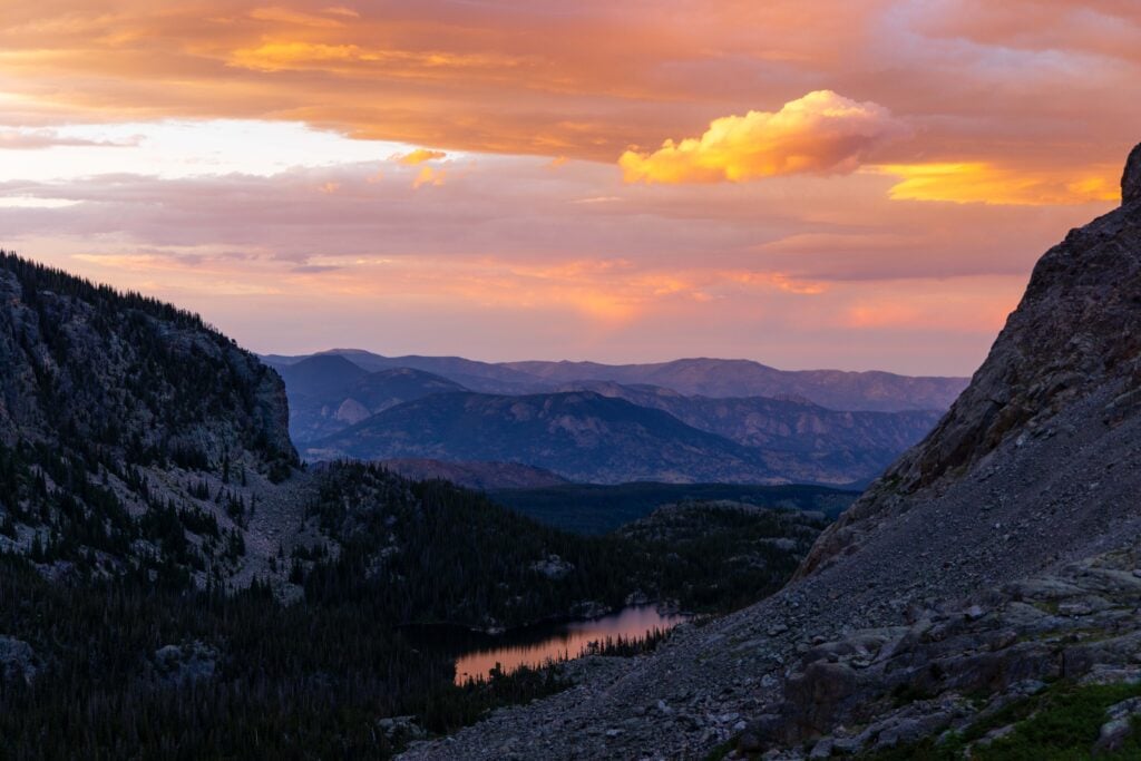 sunset over loch lake from the sky pond hike