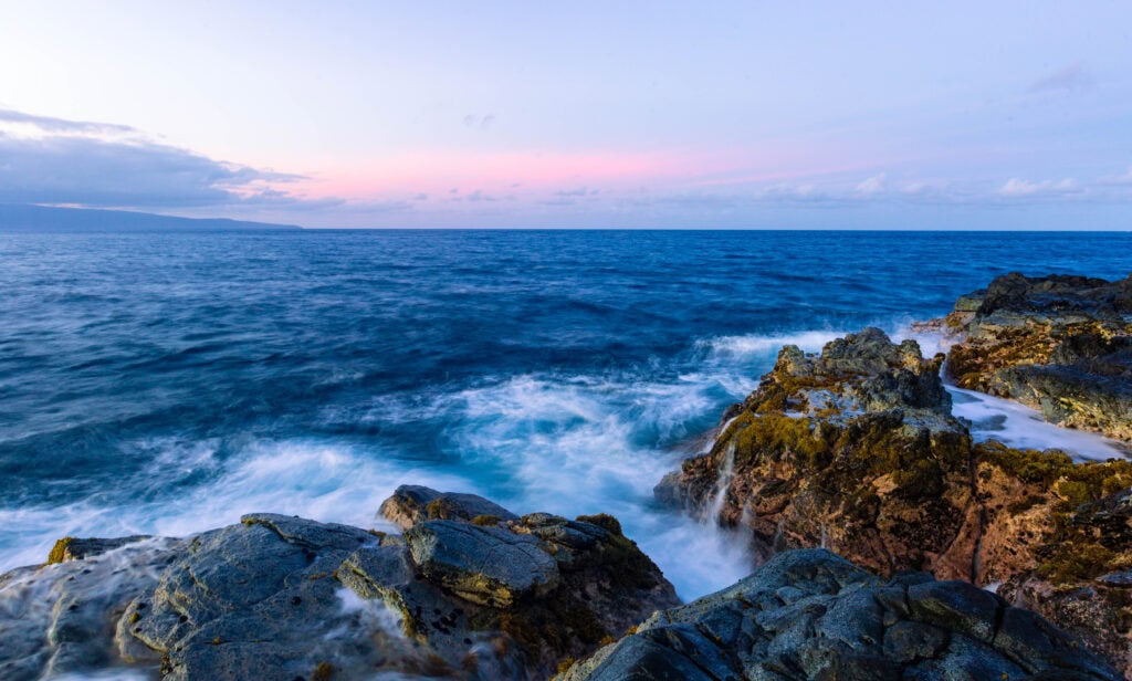 rocks meeting the ocean in maui
