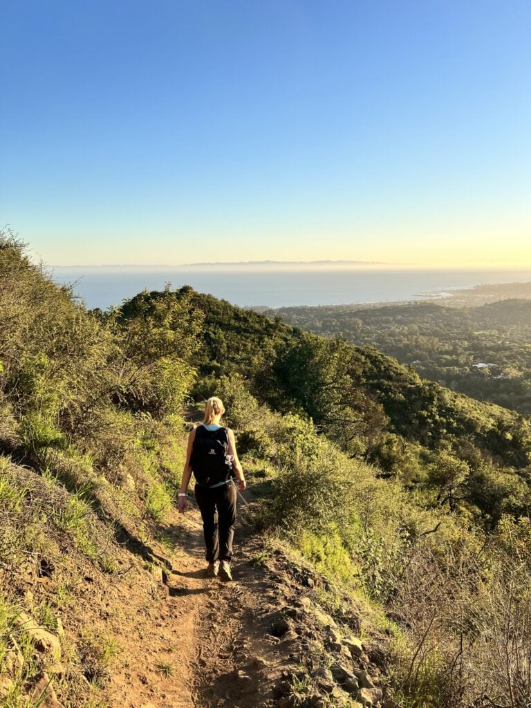 a female hiker on a trail above santa barbara