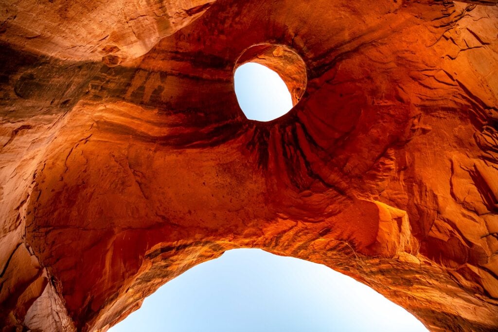a hole in the rock (eye) looking like an eagle or bird in the rock ceiling