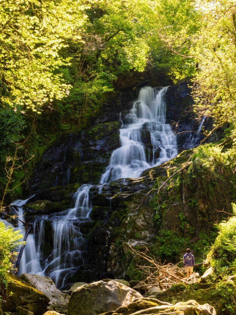a long exposure of the torc waterfall in killarney national park. one of the top things to do in ireland