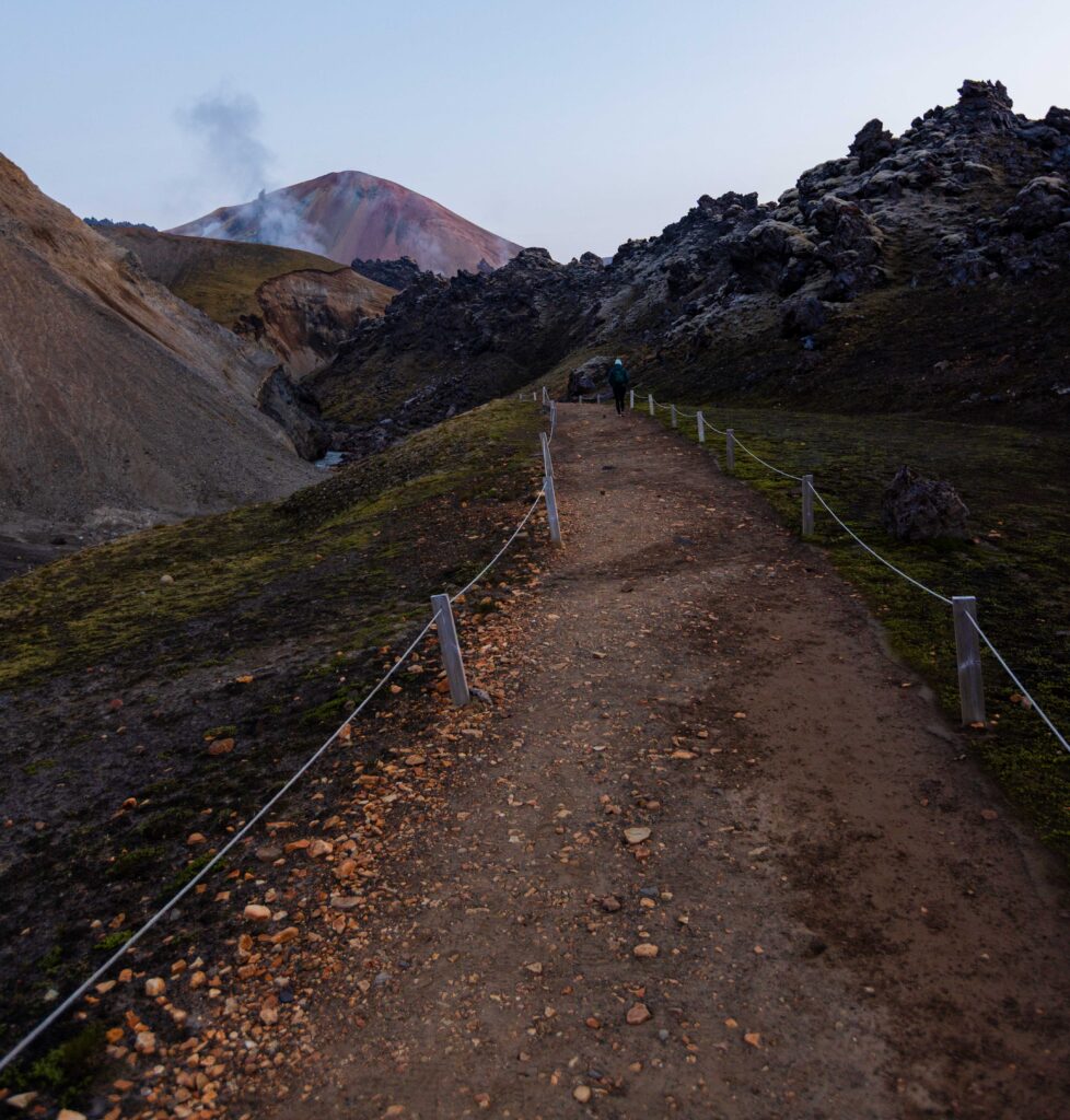 a roped off trail towards the fuming mountain