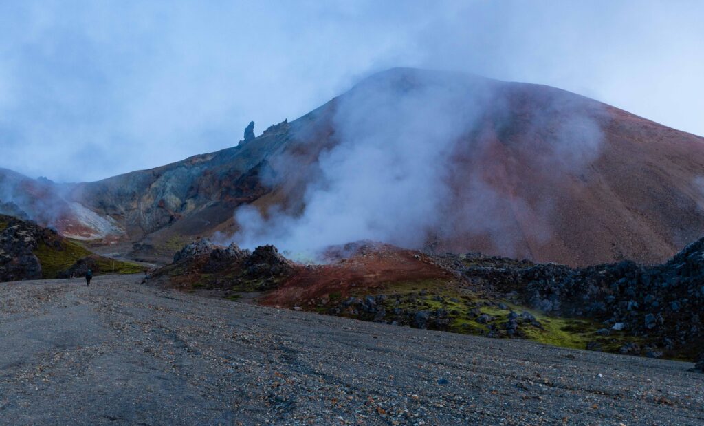 hiking on the Laugahraun with smoke plumes in view