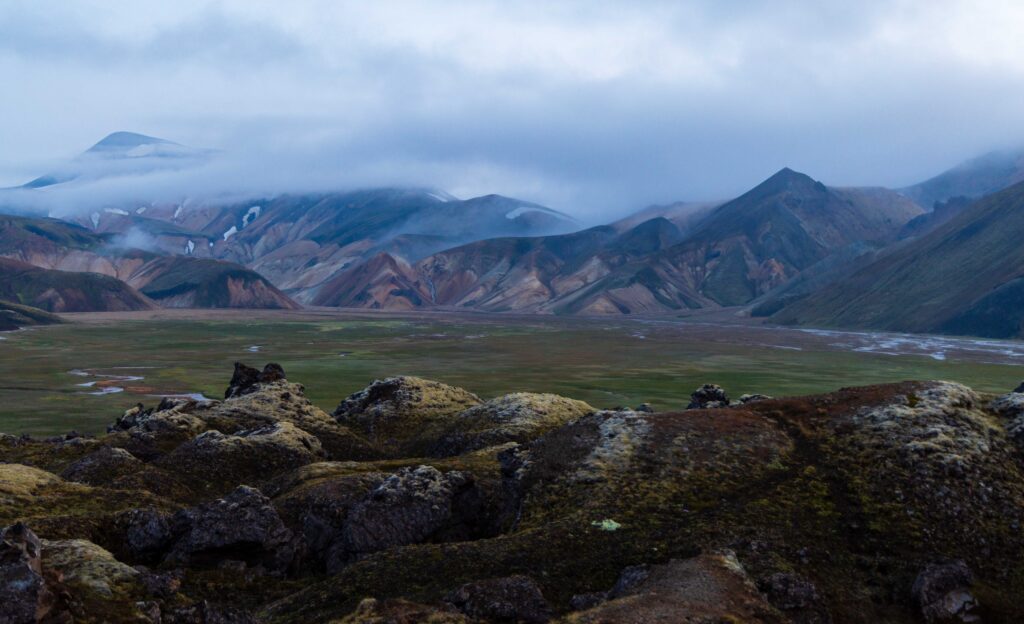 lava remains and mountains with fog rolling over them