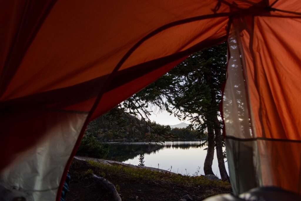 looking out the tent door at the lake after waking up
