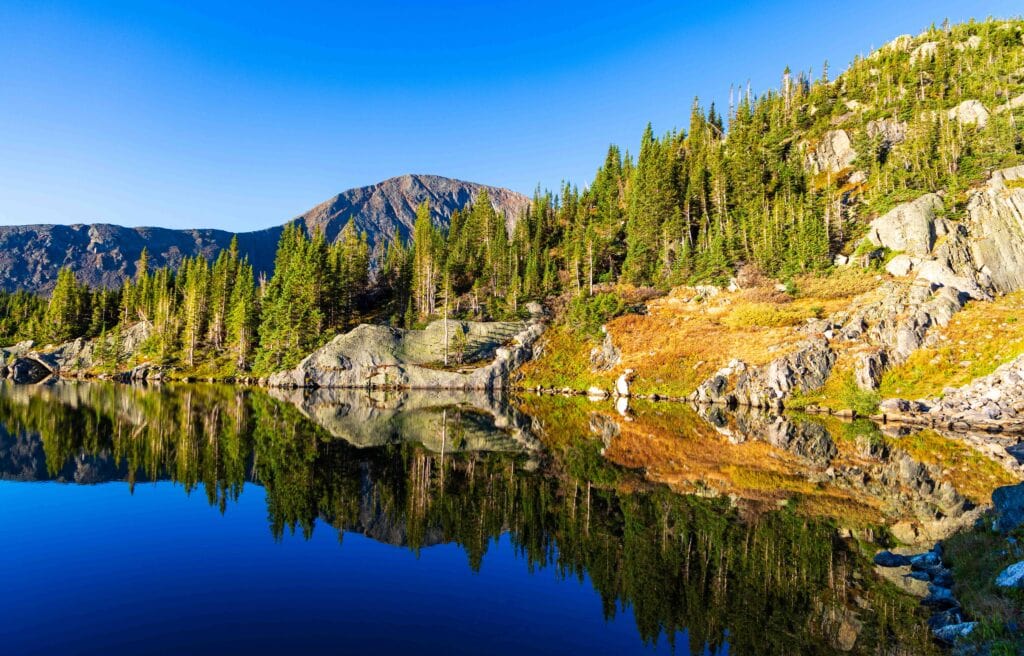 early morning light with a perfect reflection off of missouri lakes for day two of our backpacking trip