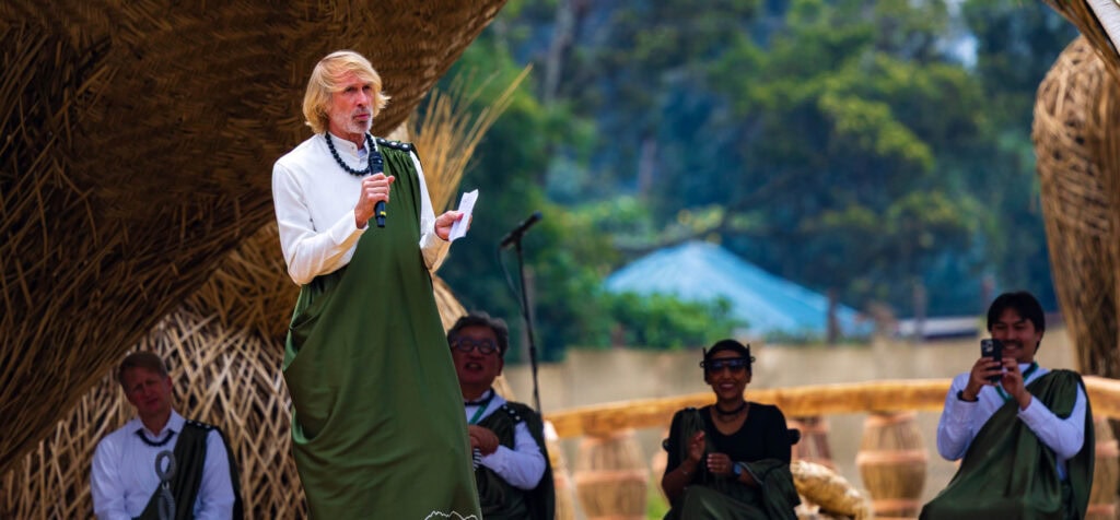 director michael bay talks on stage as he named his baby gorilla