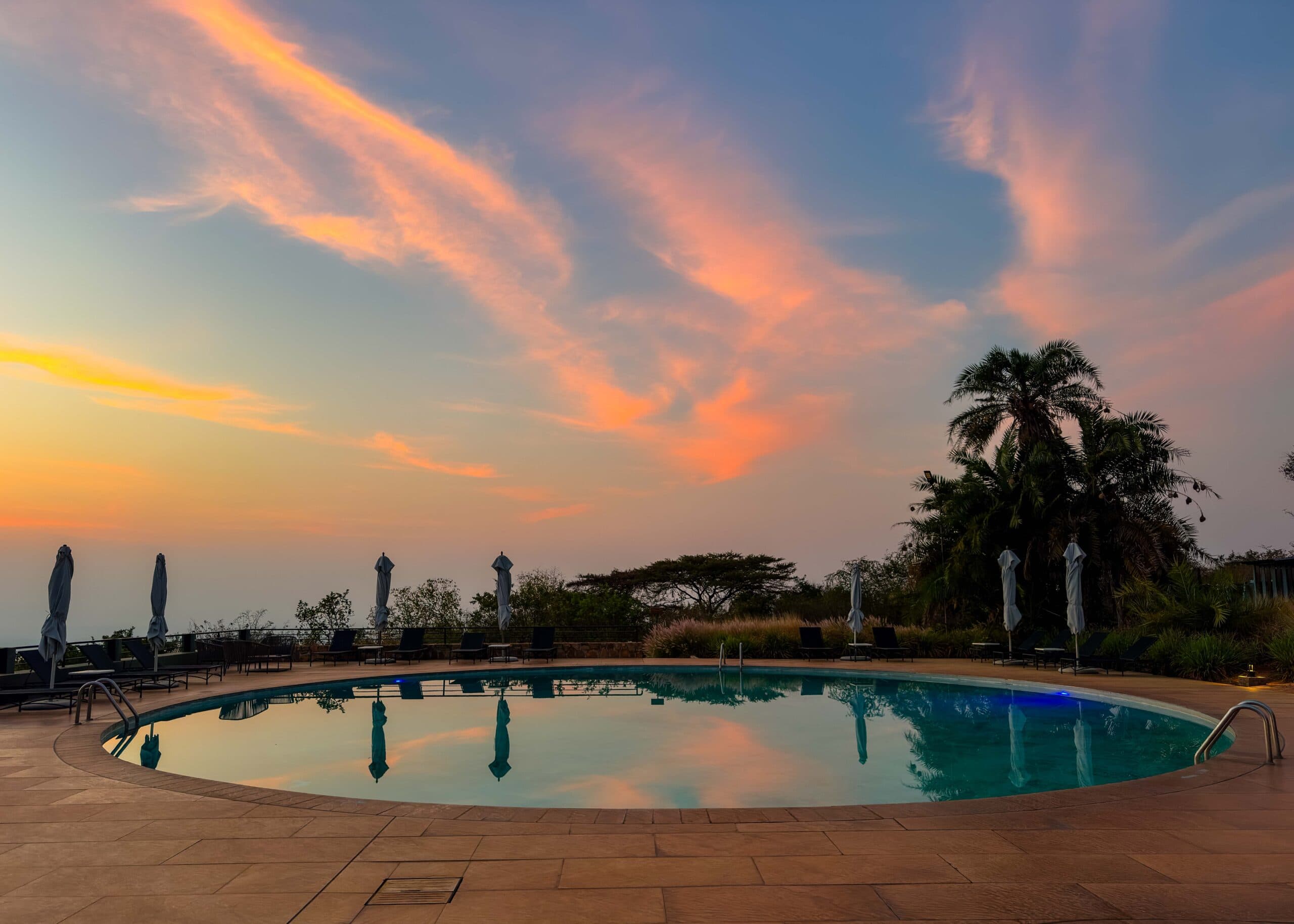 sunrise from patio area at the mantis akagera game lodge in rwanda