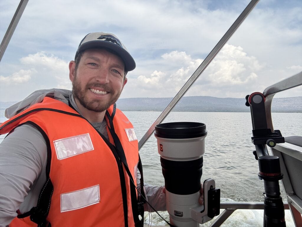 the website owner looking at the camera on a boat ride