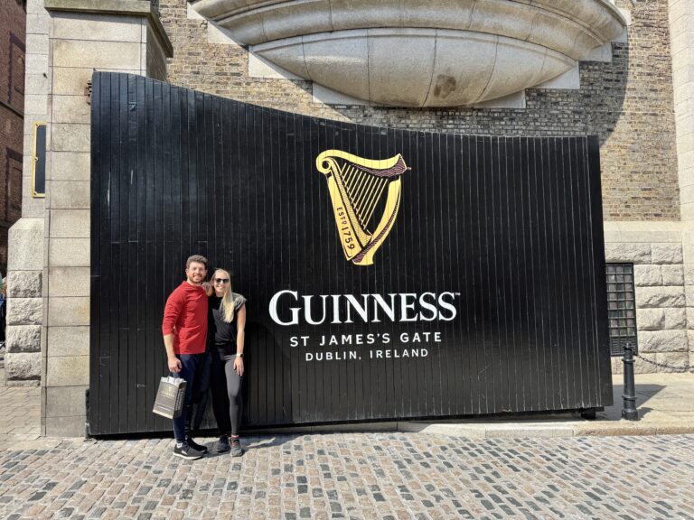 a couple standing outside of the guinness storehouse in dublin after a tour