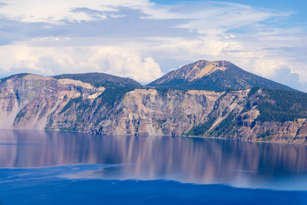 crater lake's massive slopes leading into the water