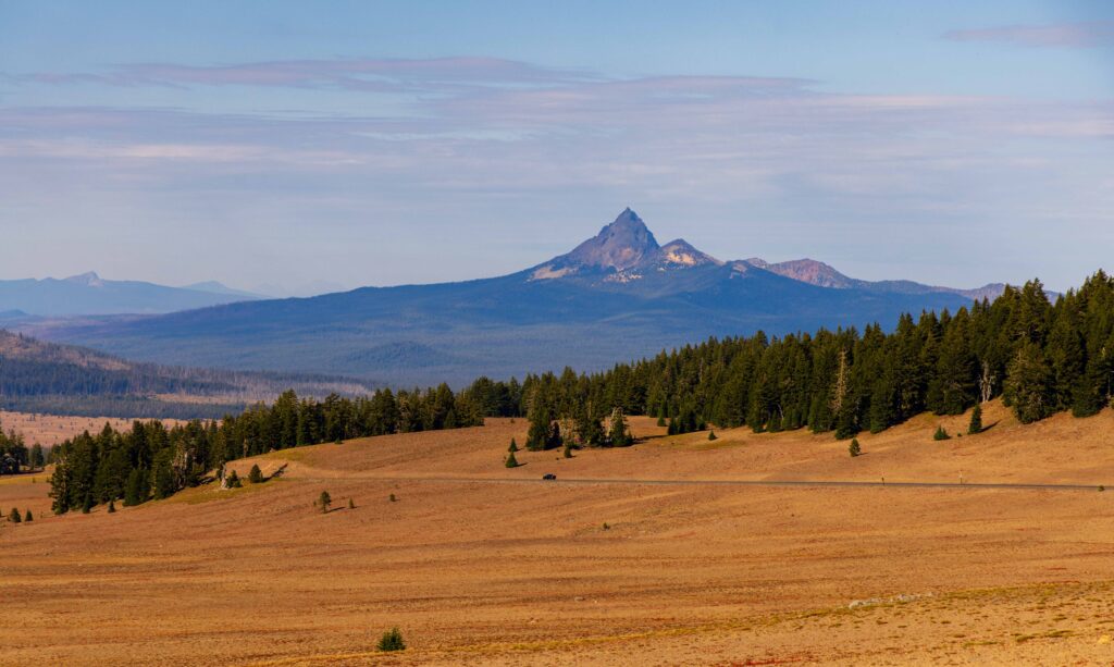 a jagged peak on the distance above a rocky lava field
