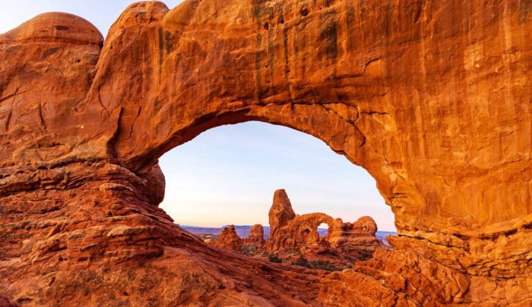 Looking through north windows arch to turret arch at sunrise