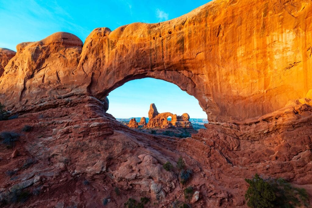 Looking through north windows arch to turret arch at sunrise