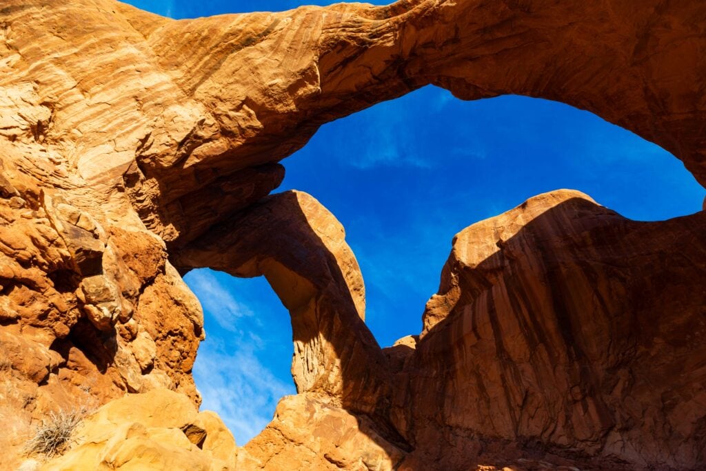 looking up at double arch in utah