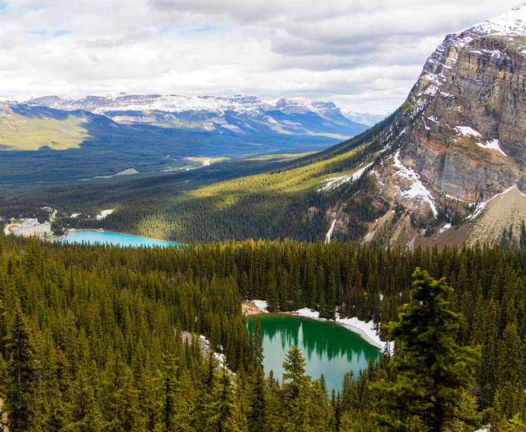 a view of mirror lake and lake louise from the little beehive trail