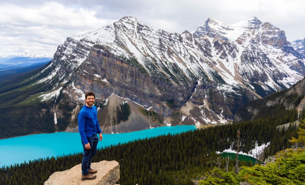 the author standing on a rock at the end of the little beehive trail in banff