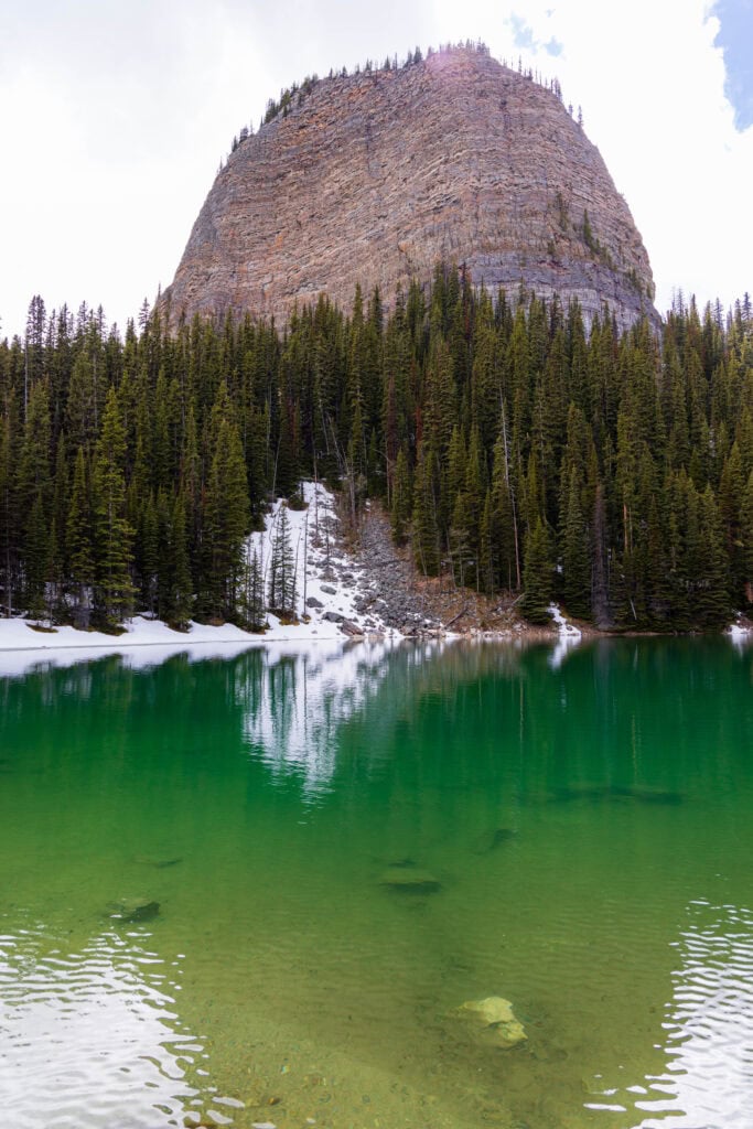 mirror lake with a little reflection off the water along the little beehive trail
