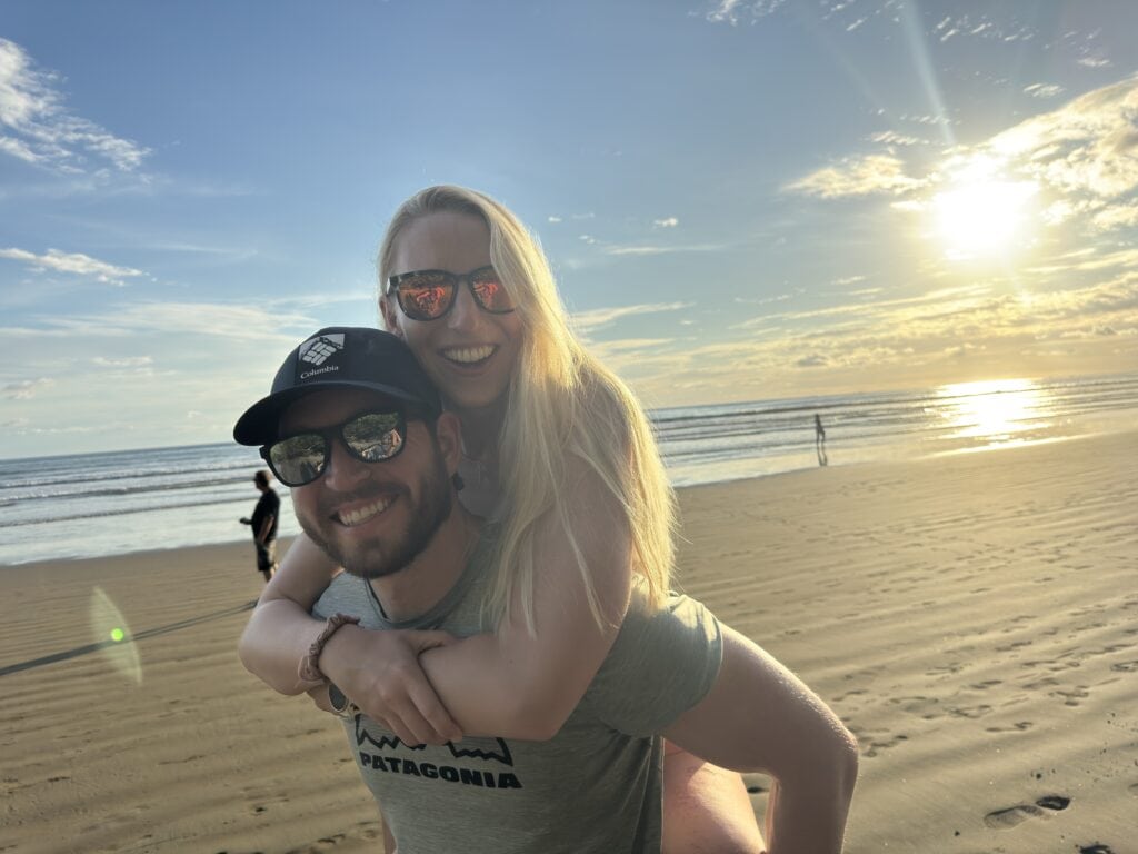 the author and his wife on uvita beach nearing sunset