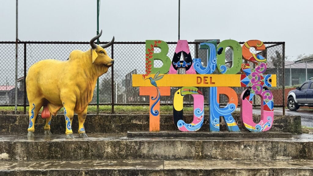 a sign that says bajos del toro in various colors