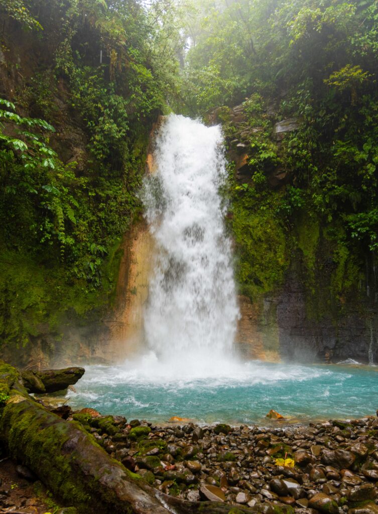 las gemalas waterfall flowing into a blue pool