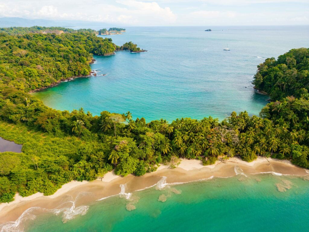 an aerial view above Manuel Antonio national park in costa rica showing two beaches